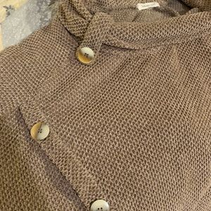 Cute comfortable sweater with eye catching details